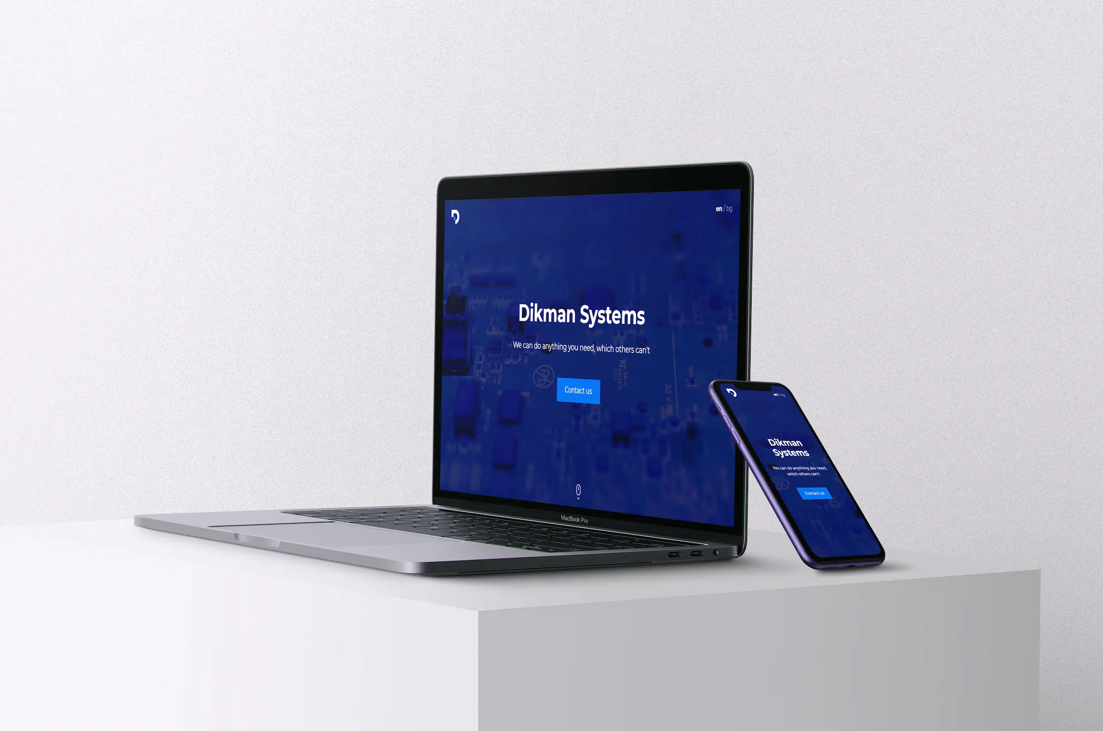 Dikman Systems Site opened on a Macbook Pro and an iPhone 11 on a white background